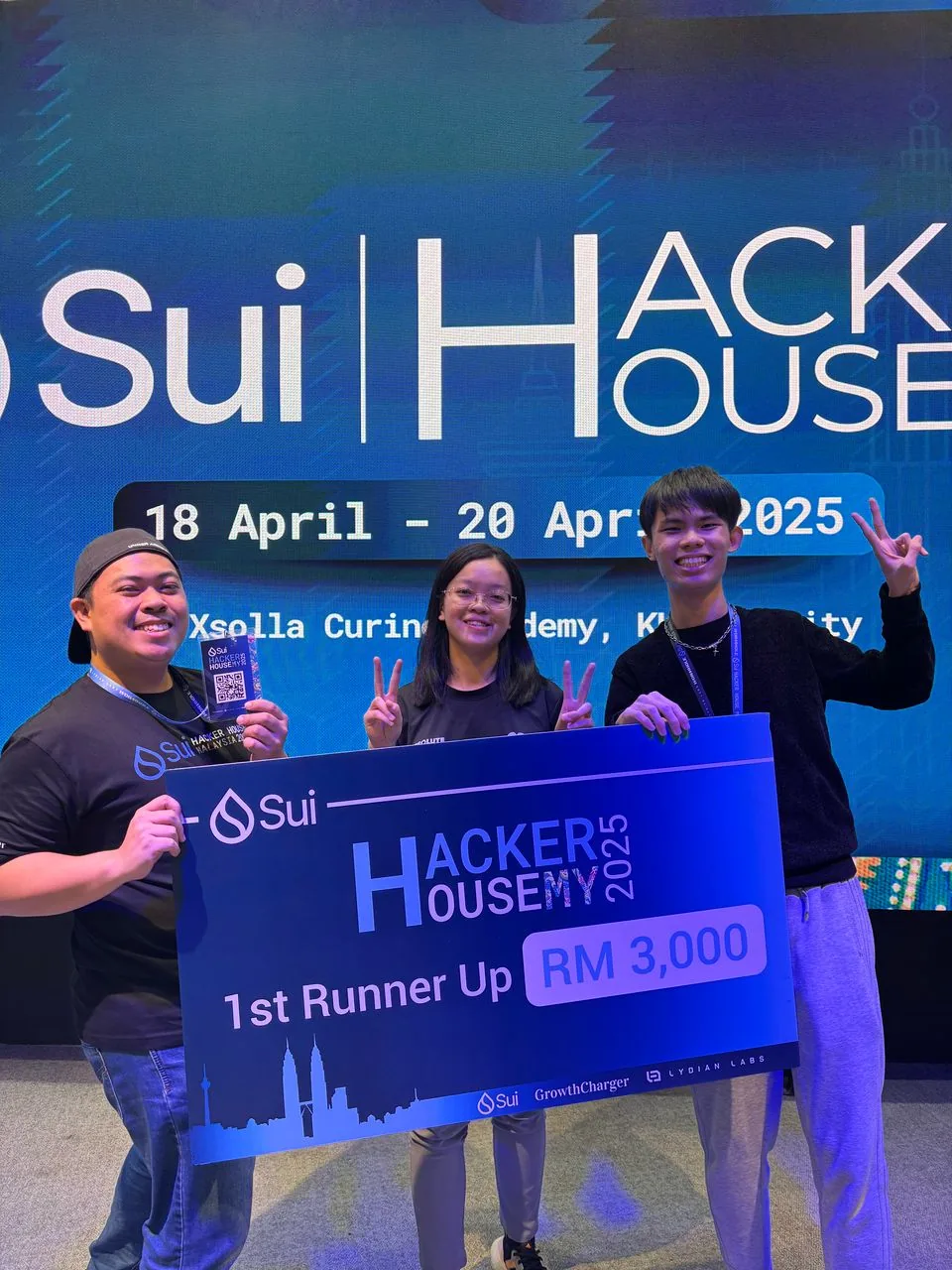 Close-up of Sui Hacker House Malaysia 2025 badge and event kit