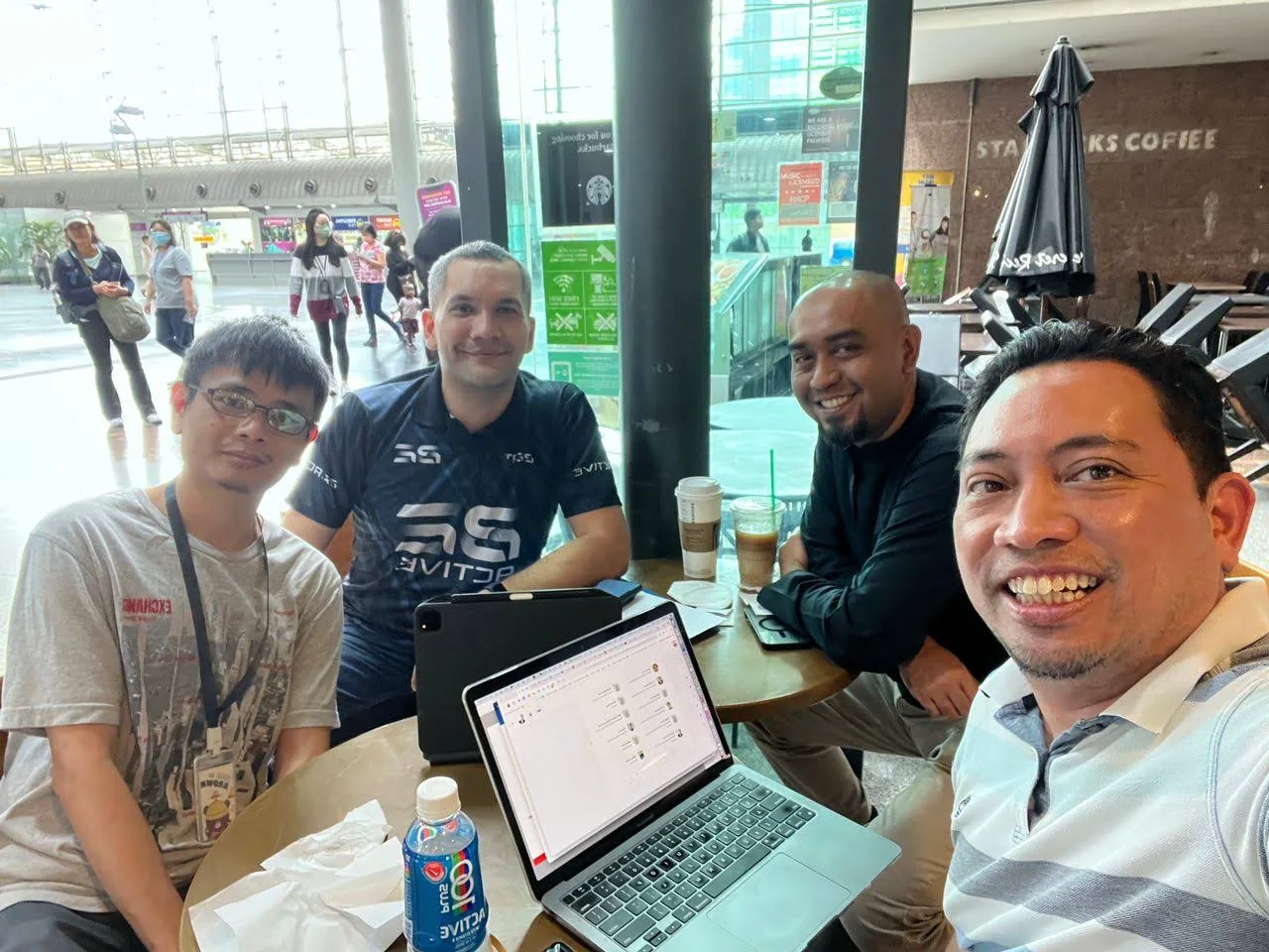 Hunter Ho holding Deriv AI Hackathon champion trophy