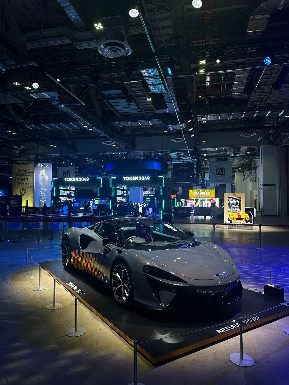 Sports car displayed inside the TOKEN2049 exhibition hall