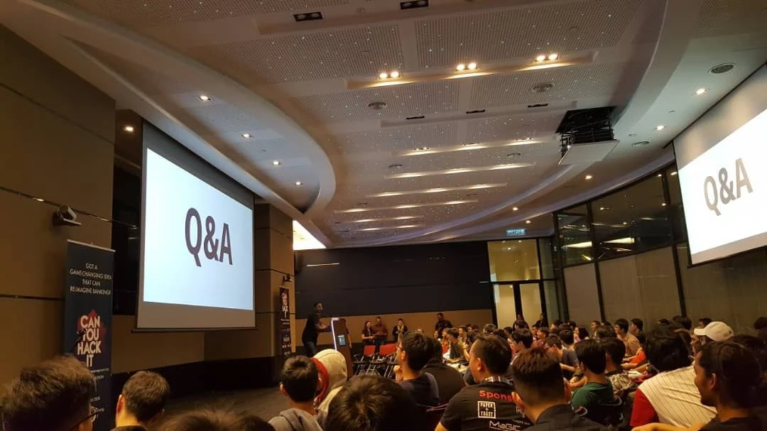 Packed audience during a live panel and Q&A session