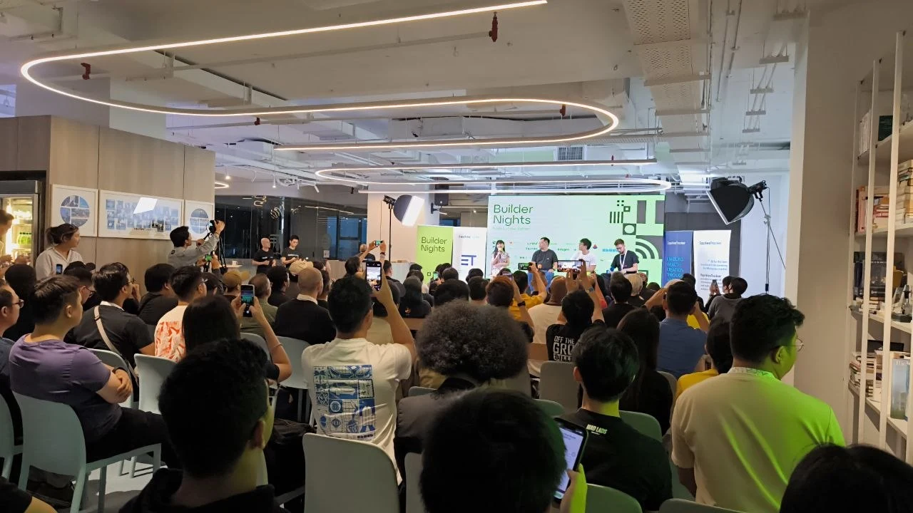 Packed audience during an ET Builder Nights panel and community session